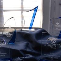 5 awards displayed on table